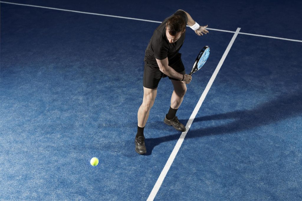 A man playing Padel Tennis